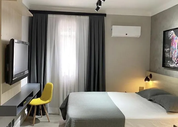 Studio moderno - Jardins: Cama Queen, Ar e Garagem